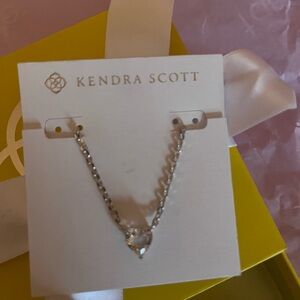 Kendra Scott Silver Heart Necklace on Yellow Box